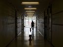 A teacher walks in the hall of a public school in Scarborough, Ont., on Monday, September 14, 2020.