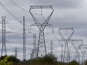 Power lines are seen against cloudy skies near Murvale, Ont., northwest of Kingston, Sept. 7, 2022.