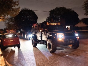 An armoured police vehicle at the scene of a shooting where a suspect shot at officers in Toronto, on Tuesday, Oct 18, 2022.