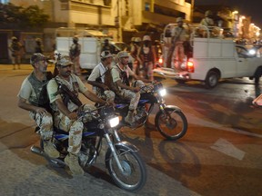 Pakistani paramilitary rangers patrol as they cordon off a street leading to the headquarters of the Muttahida Qaumi Movement (MQM) political party after it was sealed by paramilitary rangers following a raid in Karachi on late August 22, 2016.