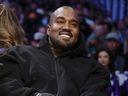Kanye West watches the first half of an NBA game between the Wizards and Lakers in Los Angeles, March 11, 2022. A completed documentary about the rapper formerly known as Kanye West has been shelved amid his recent slew of anti-Semitic remarks.
