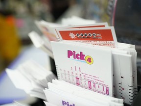 Lottery play stubs, including one for Powerball, are seen on display at a liquor store, Tuesday, Oct. 25, 2022, in Baltimore.
