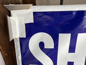 Razor blades are seen taped to campaign signs in Upper Makefield Township.