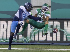 Argonauts defensive back Jamal Peters (3) kicks the ball away from Saskatchewan Roughriders receiver Kian Schaffer-Baker (89) in fourth quarter CFL action on Sunday, July 24, 2022 in Regina.  The Riders lost 31-21 to the Argos.