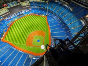 Climbers have been snapping photos and video of themselves in the rafters of Rogers Centre Dome.