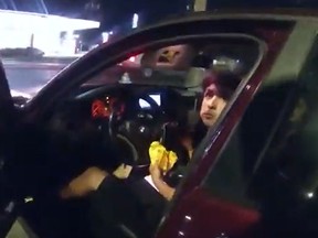 Erik Cantu, 17, is seen eating a hamburger in his car in a screen grab from San Antonio police video.