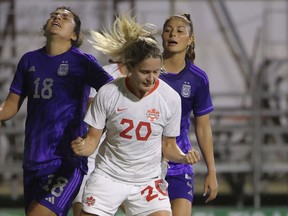 Canada's Cloe Lacasse, centre, celebrates after scoring her team's second goal during a women's international friendly soccer match between Canada and Argentina in Sanlucar de Barrameda, Spain, Thursday, Oct. 6, 2022.