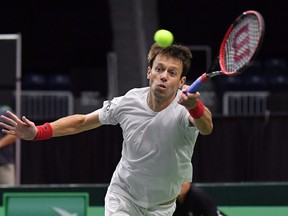 Daniel Nestor returns a shot from the team of Matwe Middelkoop and Jean-Julien Rojer, of the Netherlands, in Davis Cup tennis action in Toronto on Saturday, September 15, 2018.