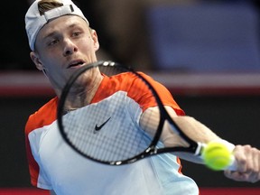 Denis Shapovalov of Canada returns to Rio Noguchi of Japan during a singles match in the Rakuten Open tennis championships at Ariake Colosseum Thursday, Oct. 6, 2022, in Tokyo.