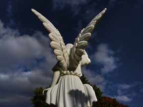 A stone angel watches over the graves at Congressional Cemetery. Michael S. Williamson/Washington Post photo