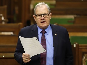 Minister of Veterans Affairs and Associate Minister of National Defence Lawrence MacAulay rises during question period in the House of Commons on Parliament Hill in Ottawa, Friday, March 25, 2022. A union representing thousands of Veterans Affairs Canada employees is asking Prime Minister Justin Trudeau to replace MacAulay.THE CANADIAN PRESS/ Patrick Doyle