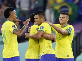 Brazil's Marquinhos, Casemiro, Eder Militao and Thiago Silva celebrate after a match.