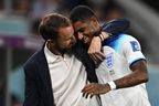 England manager Gareth Southgate congratulates forward Marcus Rashford, who scored two goals and was substituted.