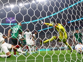 Mexico's Henry Martin scores against Saudi Arabia.