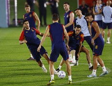 Spain's Marco Asensio, Sergio Busquets and Ferran Torres take part in training.