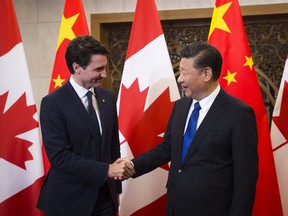 Asked twice if he would raise the issue of election interference with China's president, Justin Trudeau gave vague replies but no answer.