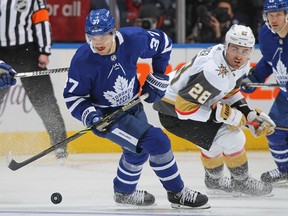 TORONTO, ON - NOVEMBER 2:  Timothy Liljegren #37 of the Toronto Maple Leafs handles the puck against William Carrier #28 of the Vegas Golden Knights at Scotiabank Arena on November 2, 2021 in Toronto, Ontario, Canada.