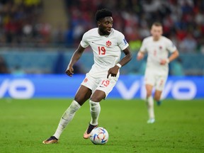 Alphonso Davies of Canada controls the ball during the FIFA World Cup Qatar 2022 Group F match between Belgium and Canada at Ahmad Bin Ali Stadium on Nov. 23, 2022 in Doha, Qatar.