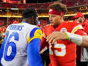 Kansas City Chiefs quarterback Patrick Mahomes (right) talks with Los Angeles Rams quarterback Bryce Perkins after a game at GEHA Field at Arrowhead Stadium on Nov. 27, 2022.