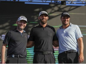 Branden Grace of Stinger GC, Team Captain Dustin Johnson of 4 Aces GC and Peter Uihlein of Smash GC pose on the podium after being named top three golfers for LIV Golf at the LIV Golf Invitational - Miami at Trump National Doral Miami on October 30, 2022 in Doral, Florida.