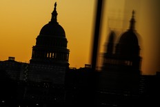 The U.S. Capitol dome is seen from the base of the Washington Monument as the sun rises on Nov. 9, 2022 in Washington, DC.