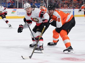 Alex DeBrincat #12 of the Ottawa Senators controls the puck against Travis Sanheim #6 of the Philadelphia Flyers in the third period at the Wells Fargo Center on November 12, 2022 in Philadelphia, Pennsylvania. The Ottawa Senators defeated the Philadelphia Flyers 4-1. (Photo by Mitchell Leff/Getty Images)