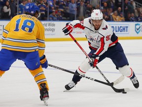 Evgeny Kuznetsov of the Washington Capitals controls the puck against the St. Louis Blues in overtime at Enterprise Center on November 17, 2022 in St Louis, Missouri.