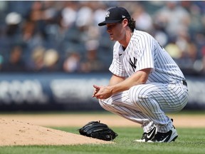 Gerrit Cole of the New York Yankees reacts while pitching during the fifth inning against the Toronto Blue Jays at Yankee Stadium on August 20, 2022 in the Bronx borough of New York City.