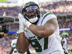 Nathan Shepherd of the New York Jets reacts after a play against the Denver Broncos during the second half at Empower Field At Mile High on October 23, 2022 in Denver, Colorado.