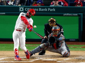 Bryce Harper of the Philadelphia Phillies hits a two-run home run against the Houston Astros during the first inning in Game Three of the 2022 World Series at Citizens Bank Park on November 01, 2022 in Philadelphia, Pennsylvania.