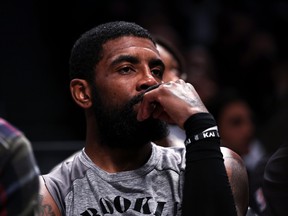 Kyrie Irving #11 of the Brooklyn Nets looks on from the bench during the second quarter of the game against the Chicago Bulls at Barclays Center on November 1, 2022 in New York City.