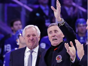 Former Toronto Maple Leaf Borje Salming, right, returns to the ice for a pregame ceremony prior to the game between the Toronto Maple Leafs and the Pittsburgh Penguins at the Scotiabank Arena on November 11, 2022 in Toronto alongside Darryl Sittler.