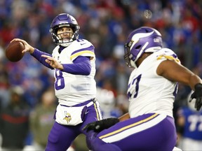 Kirk Cousins of the Minnesota Vikings attempts a pass during overtime against the Buffalo Bills at Highmark Stadium on November 13, 2022 in Orchard Park, New York.