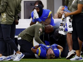 Cooper Kupp of the Los Angeles Rams lays on the ground with an injury during the fourth quarter of the game against the Arizona Cardinals at SoFi Stadium on November 13, 2022 in Inglewood, California.