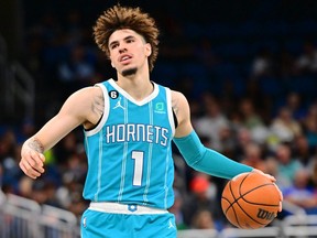 LaMelo Ball of the Charlotte Hornets controls the ball in the first half against the Orlando Magic at Amway Center on November 14, 2022 in Orlando, Florida.