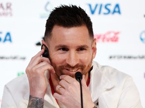 Lionel Messi of Argentina reacts during a news conference at Main Media Center on November 21, 2022 in Doha, Qatar.