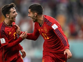 Spain's Ferran Torres celebrates with Gavi after scoring his team's fourth goal against Costa Rica.