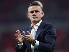 Canada coach John Herdman gestures to fans during the  World Cup.