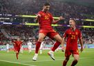 Spain's Marco Asensio celebrates scoring their second goal with Dani Olmo.