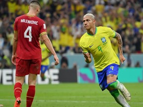 Richarlison of Brazil celebrates after scoring their team's second goal during the FIFA World Cup.