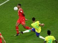 Brazil's Casemiro scores their first goal against Switzerland.