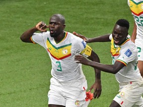 Senegal defender Kalidou Koulibaly celebrates after scoring his team's second goal against Ecuador.