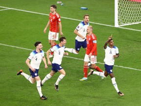England's Marcus Rashford (right) celebrates after scoring their team's first goal against Wales.