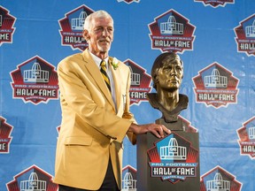 Former NFL punter Ray Guy with his bust during the NFL Class of 2014 Pro Football Hall of Fame Enshrinement Ceremony at Fawcett Stadium on August 2, 2014 in Canton, Ohio.