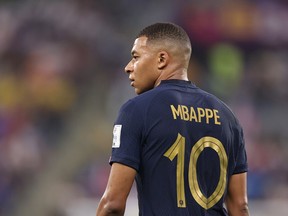 Kylian Mbappe of France looks on during the FIFA World Cup Qatar 2022 Group D match between France and Denmark at Stadium 974 on November 26, 2022 in Doha, Qatar.
