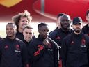 Members of the Belgian national football team (LR) Kevin De Bruyne, Lois Openda, Wout Faes, Leandro Trossard, Jeremy Doku, Romelu Lukaku and Yannick Carrasco pose for a photo near the new Brussels Airlines Belgian Icon 