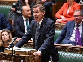 A handout photograph released by the UK Parliament shows Britain's Chancellor of the Exchequer Jeremy Hunt making an autumn budget statement in the House of Commons in London on November 17, 2022.