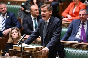 A handout photograph released by the UK Parliament shows Britain's Chancellor of the Exchequer Jeremy Hunt making an autumn budget statement in the House of Commons in London on November 17, 2022.