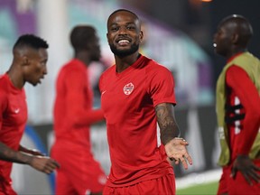 Canada's forward #17 Cyle Larin smiles as he takes part in a training session at the Umm Salal SC training facilities in Doha on November 30, 2022, on the eve of the Qatar 2022 World Cup football match between Canada and Morocco. (Photo by Patrick T. Fallon / AFP)