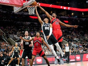 San Antonio Spurs' Romeo Langford drives to the basket against Raptors' Christian Koloko during the first half at in San Antonio on Wednesday, Nov. 2, 2022.